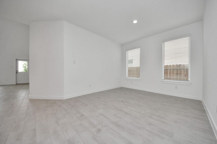 Make memories gathered around the table with your family and friends! This spacious dining room features elegant flooring, custom paint, and adjacent to family room and kitchen for open concept feel.