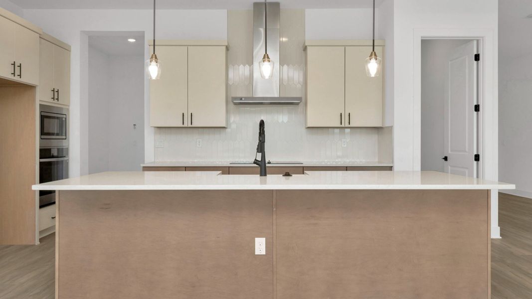 The Kitchen of a DRB Homes Grand Hawk which is offered as a home plan at Serengeti in Spring Hill, FL.