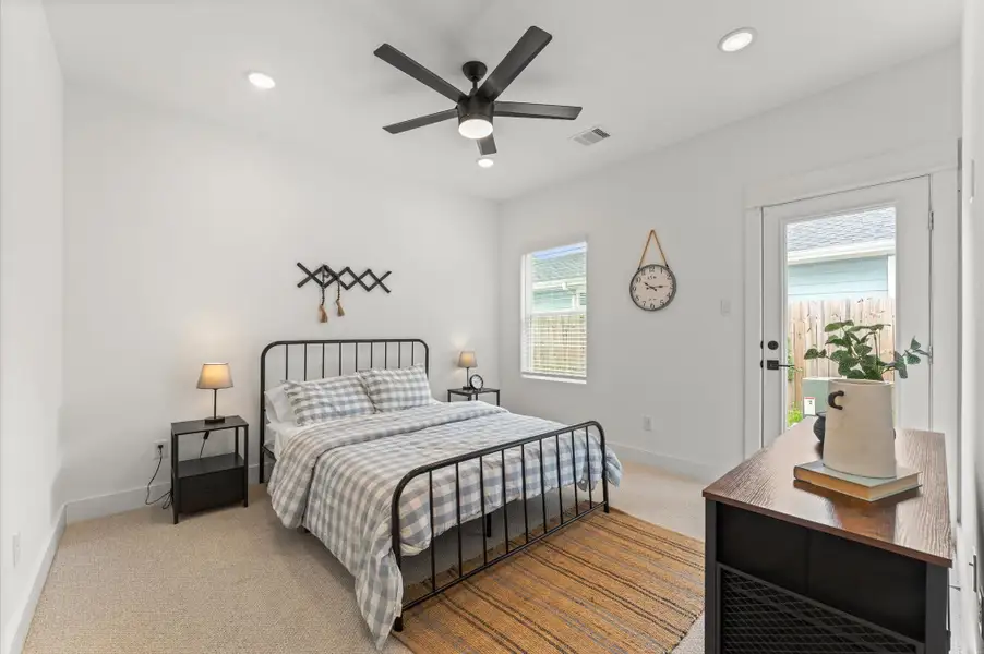 Stylish and versatile secondary bedroom situated on the first floor, offering direct access to the backyard through elegant glass patio door. This sunlit space features generous room for a queen-sized bed and additional furnishings - Ideal for accommodating guests or family members with ease and privacy. Outdoor access enhances the room’s appeal for relaxation, remote work, or multi-generational living. Stylish and versatile secondary bedroom situated on the first floor, offering direct access to the backyard through elegant glass patio door. This sunlit space features generous room for a queen-sized bed and additional furnishings - Ideal for accommodating guests or family members with ease and privacy. Outdoor access enhances the room’s appeal for relaxation, remote work, or multi-generational living.