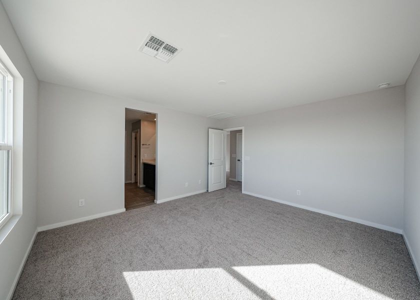 A hallway with white walls.
