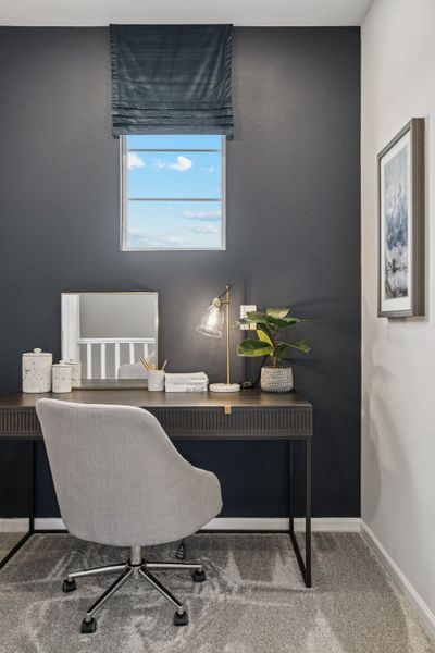 A desk with a chair and a window.