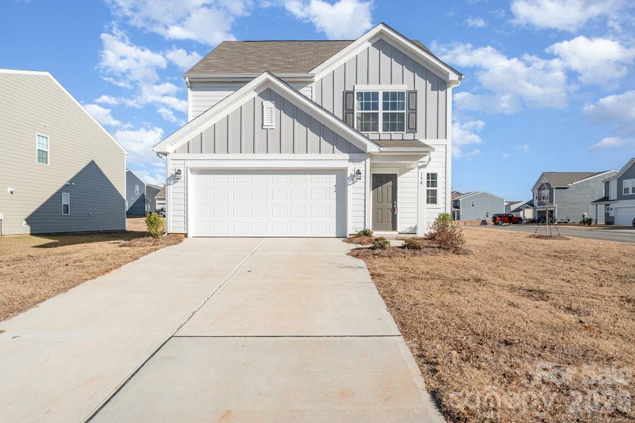 Front exterior of a new home in Sullivan Farm, Statesville, NC, highlighting curb appeal (Image 2). Front exterior of a new home in Sullivan Farm, Statesville, NC, highlighting curb appeal (Image 2).