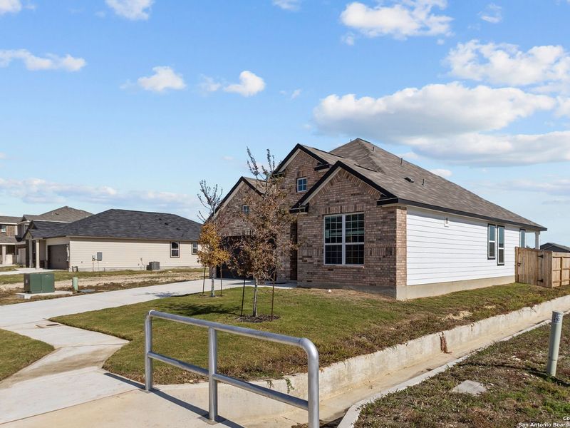 Front exterior of a new home in Hannah Heights, Seguin, TX, highlighting curb appeal (Image 20).