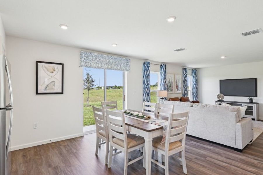 A room with a table and chairs.