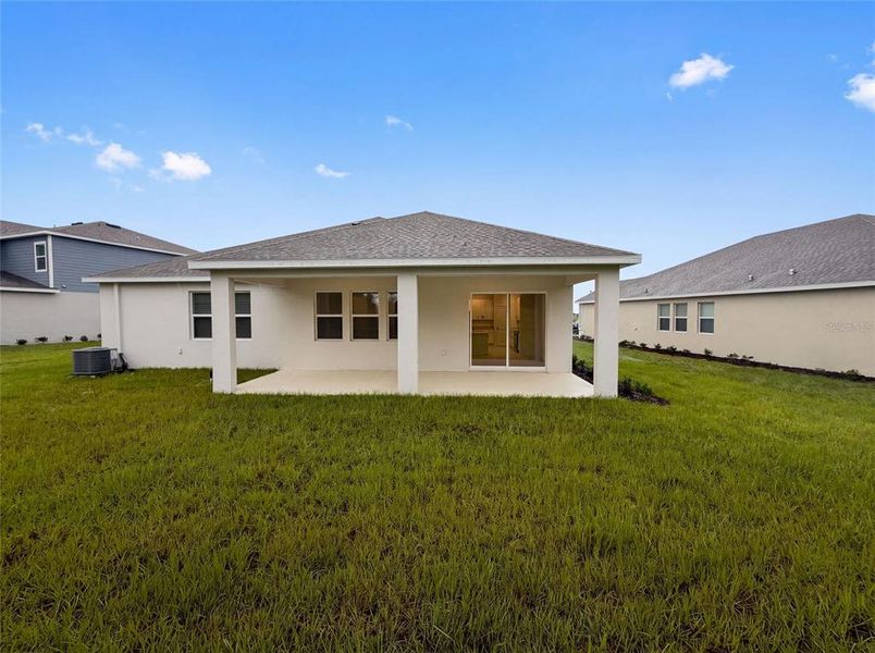 Exterior details and patio area of a home in Meadow Pointe, Groveland (Image 4).