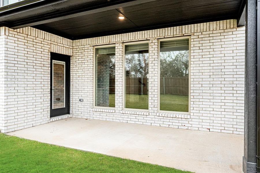 Exterior details and patio area of a home in East Oak Creek 60-65, Commerce (Image 3). Exterior details and patio area of a home in East Oak Creek 60-65, Commerce (Image 3).