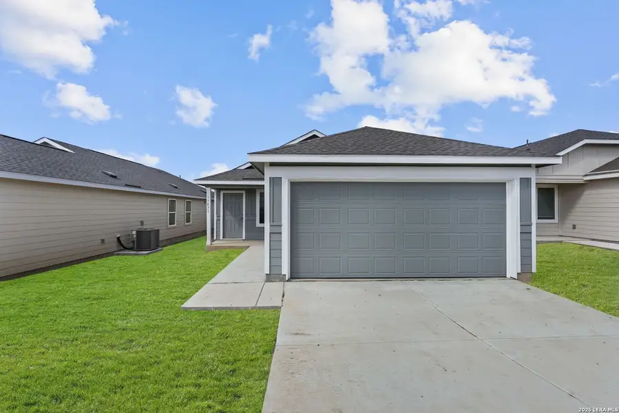 Front exterior of a new home in Hidden Oasis, San Antonio, TX, highlighting curb appeal (Image 17).