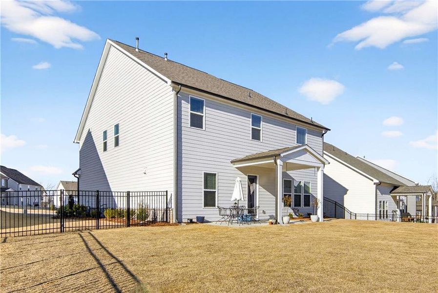 Exterior details and patio area of a home in East Harbor II at Chestatee, Dawsonville (Image 23).