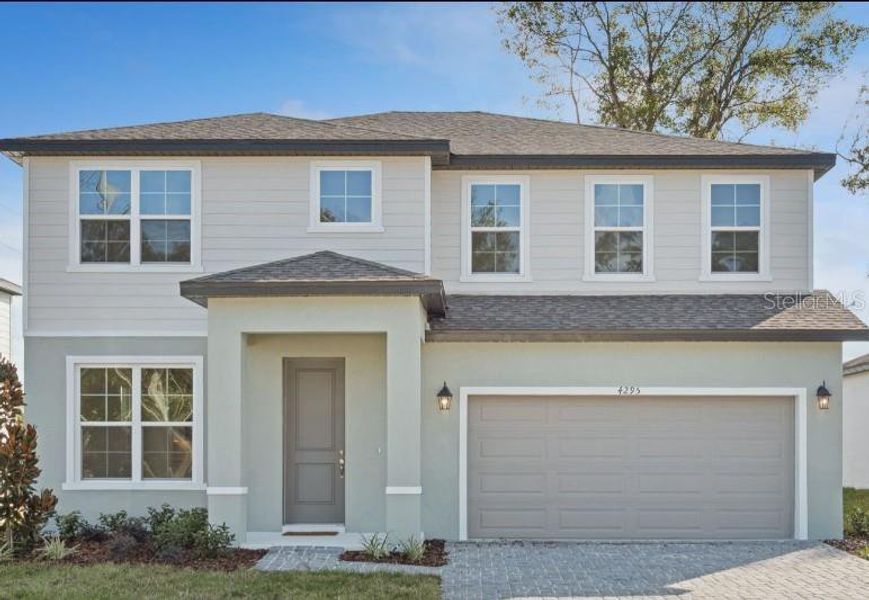 Front exterior of a new home in Estes Reserve, Eustis, FL, highlighting curb appeal (Image 1). Front exterior of a new home in Estes Reserve, Eustis, FL, highlighting curb appeal (Image 1).