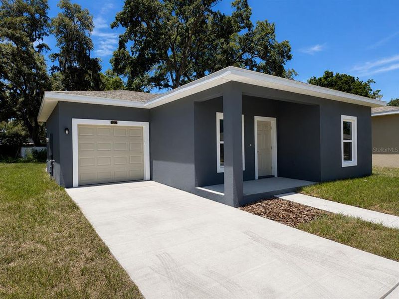 Front exterior of a new home in , Tampa, FL, highlighting curb appeal (Image 2). Front exterior of a new home in , Tampa, FL, highlighting curb appeal (Image 2).