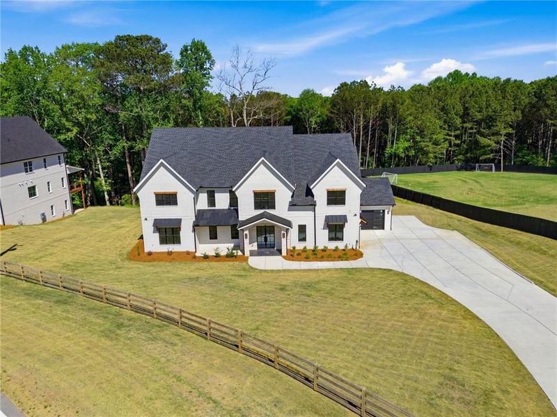 Front exterior of a new home in , Bethlehem, GA, highlighting curb appeal (Image 25).