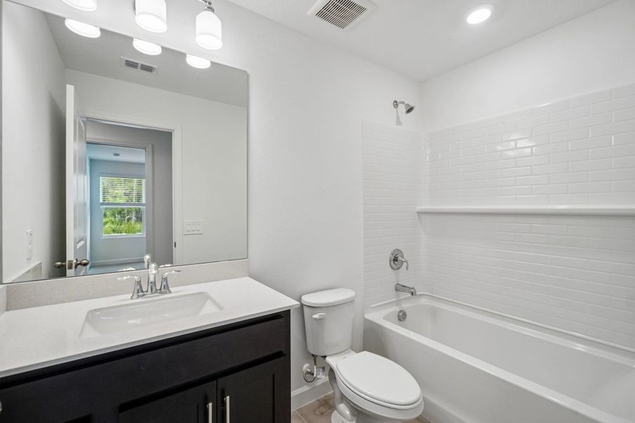 Bathroom 2 located off the hallway near bedroom 2 and 3