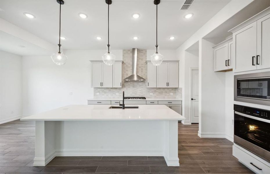 Bright kitchen with oversized island *real home pictured