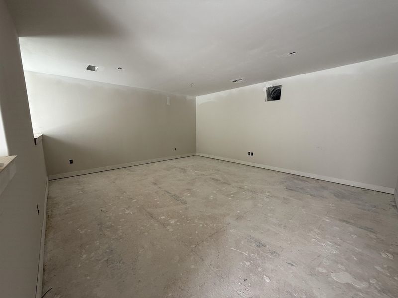 Empty room featuring baseboards