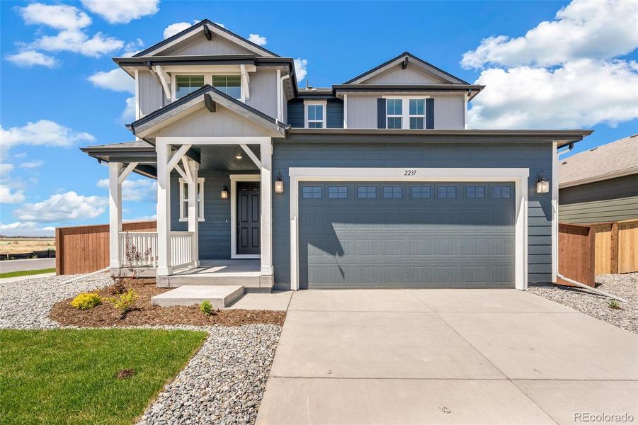 Front exterior of a new home in Farmlore, Brighton, CO, highlighting curb appeal (Image 20).