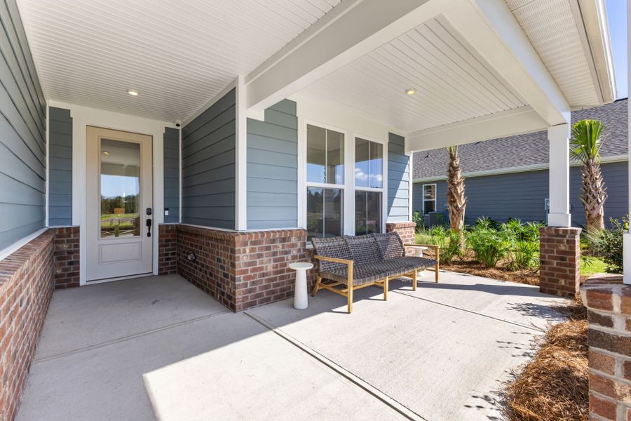 Exterior details and patio area of a home in Del Webb Ocean Isle Beach, Shallotte (Image 4).