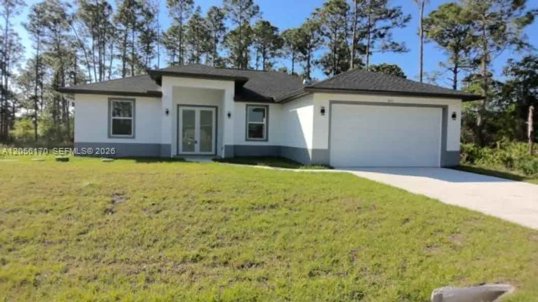 Front exterior of a new home in , Lehigh Acres, FL, highlighting curb appeal (Image 1). Front exterior of a new home in , Lehigh Acres, FL, highlighting curb appeal (Image 1).