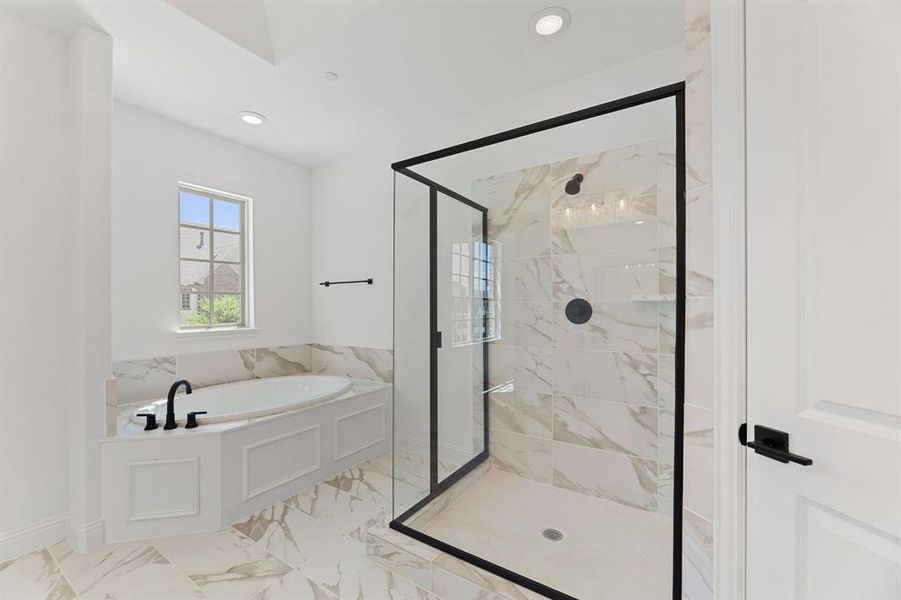 Full bath featuring a marble finish shower, a bath, recessed lighting, and light marble finish flooring Full bath featuring a marble finish shower, a bath, recessed lighting, and light marble finish flooring