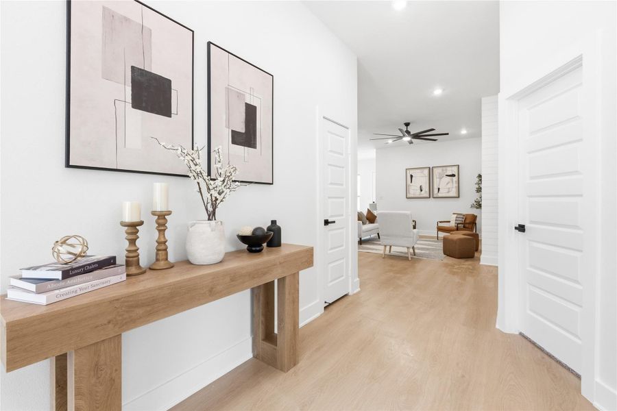 Hallway featuring light wood-type flooring and recessed lighting