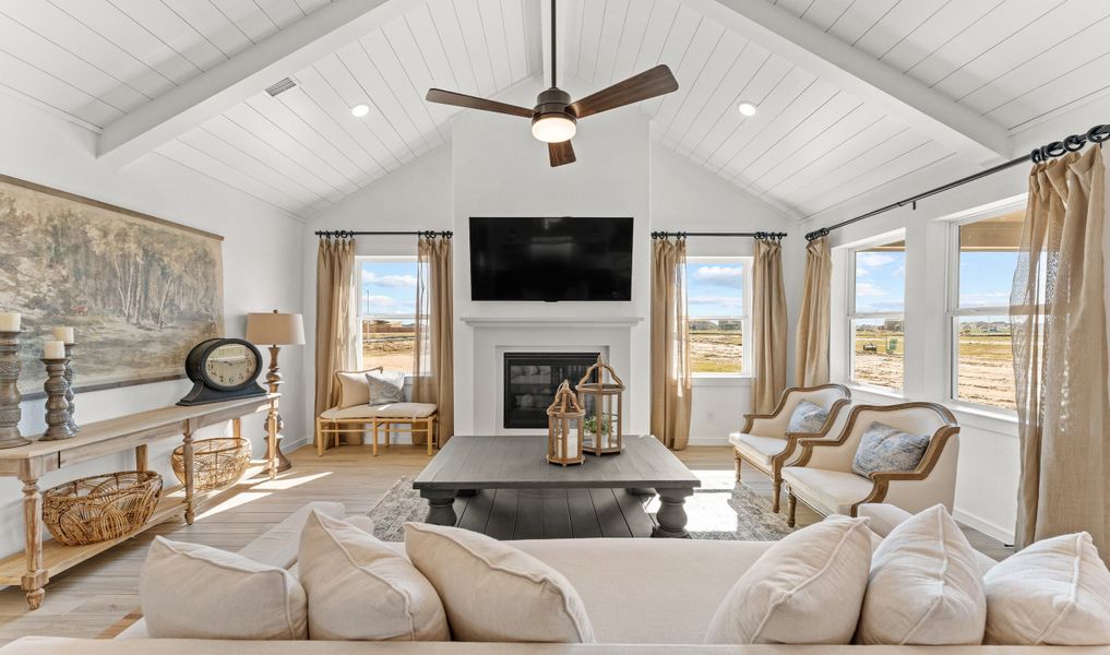Great room with white painted shiplap and vaulted ceiling Great room with white painted shiplap and vaulted ceiling