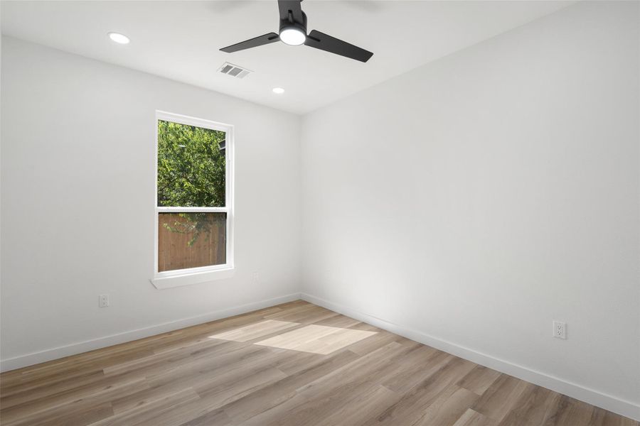 Empty room with wood finished floors, recessed lighting, and ceiling fan Empty room with wood finished floors, recessed lighting, and ceiling fan