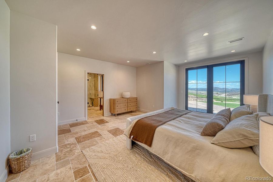 The second primary suite includes French doors to the exterior. The second primary suite includes French doors to the exterior.