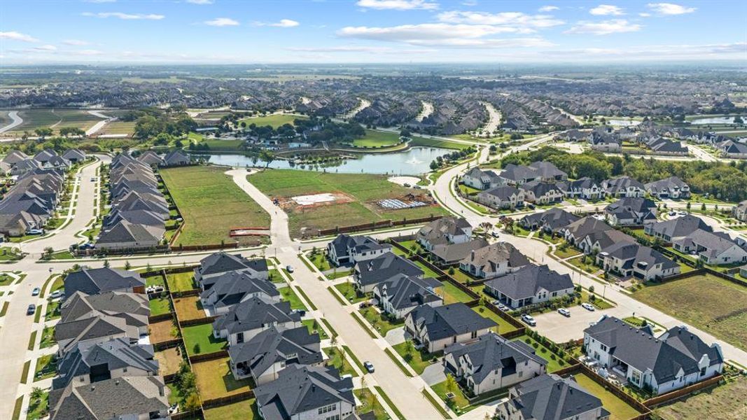Aerial overview of property's location with a nearby body of water and nearby suburban area