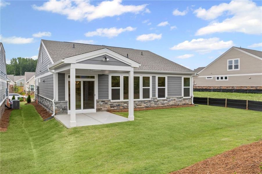 Front exterior of a new home in Laurel Farms, Dallas, GA, highlighting curb appeal (Image 22). Front exterior of a new home in Laurel Farms, Dallas, GA, highlighting curb appeal (Image 22).