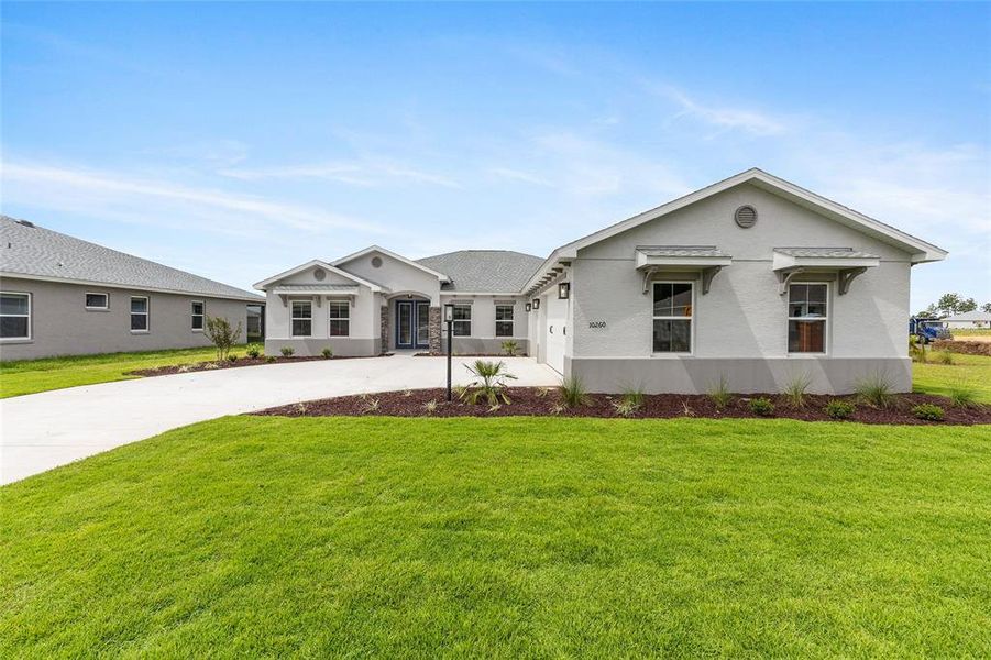 Front exterior of a new home in On Top of the World Communities, Ocala, FL, highlighting curb appeal (Image 24).
