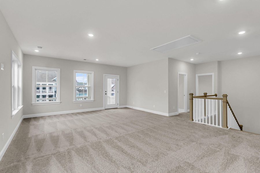 Spacious, unfurnished interior of a new home in Tidewater at Lakes of Cane Bay, Summerville (Image 44).