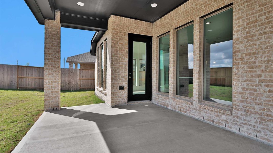 Exterior details and patio area of a home in Meridiana, Manvel (Image 14).