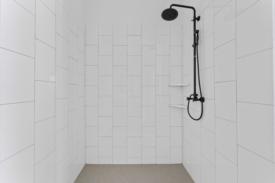 Luxurious en-suite with double vanity, framed mirrors, elegant fixtures, and a spa-like feel. Luxurious en-suite with double vanity, framed mirrors, elegant fixtures, and a spa-like feel.