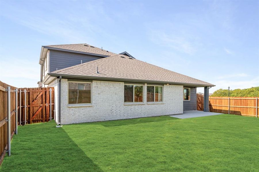 Exterior details and patio area of a home in Bear Creek Elements, Lavon (Image 27).