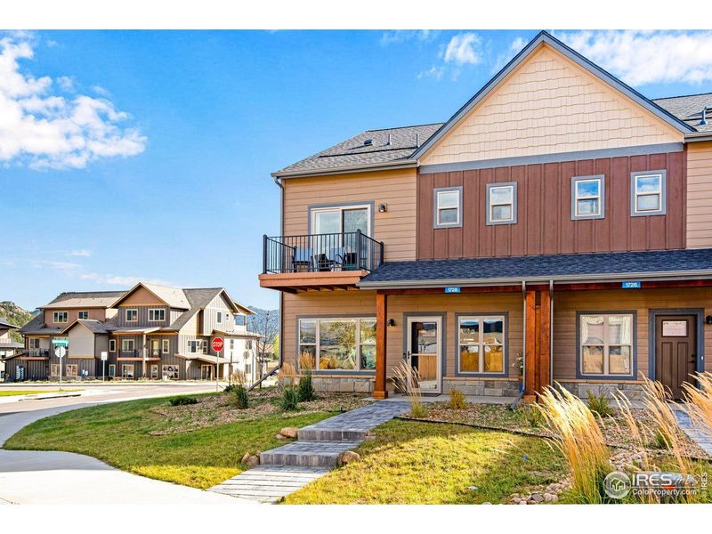 Front exterior of a new home in , Estes Park, CO, highlighting curb appeal (Image 21).
