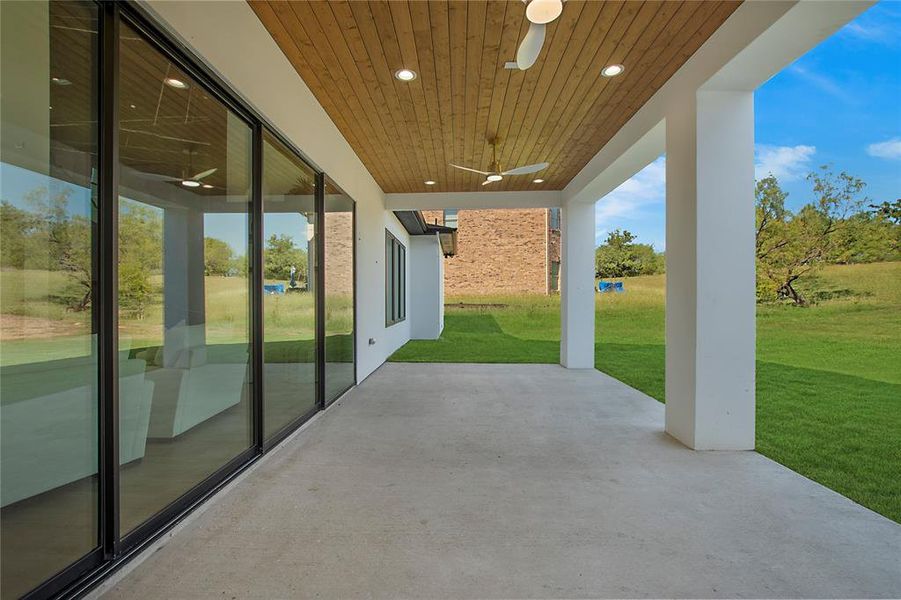 View of patio featuring ceiling fan