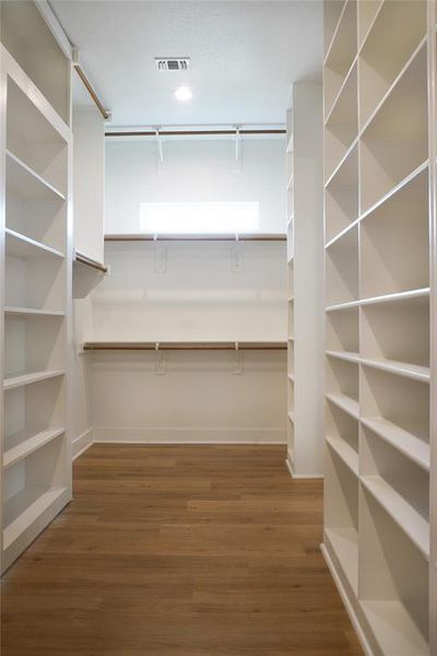 Spare room with a mountain view and light hardwood / wood-style flooring