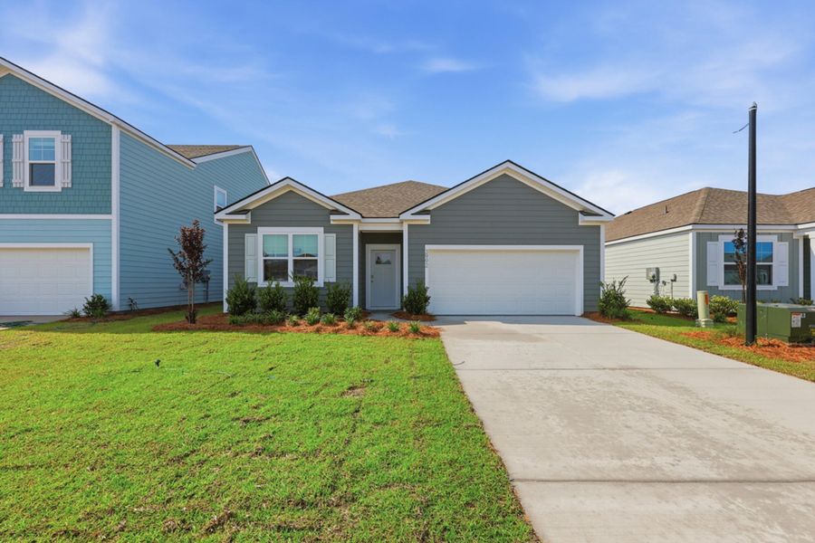 Front exterior of a new home in Hillcrest, Ravenel, SC, highlighting curb appeal (Image 1). Front exterior of a new home in Hillcrest, Ravenel, SC, highlighting curb appeal (Image 1).