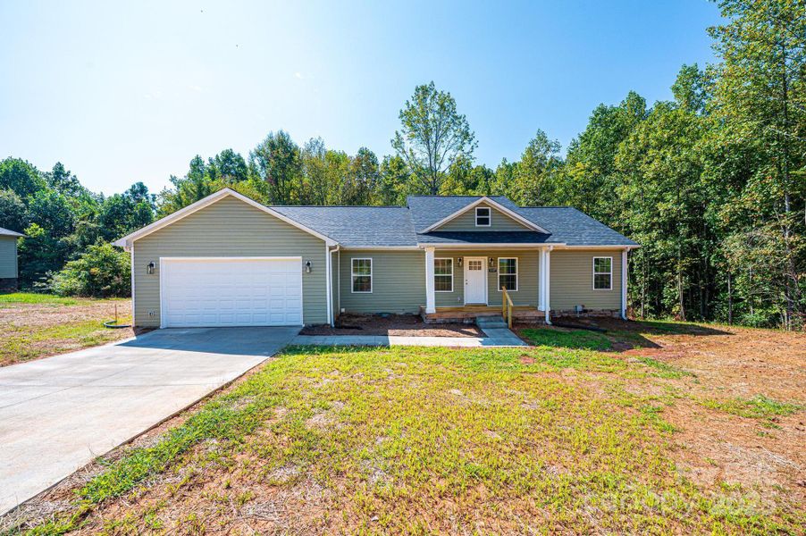Front exterior of a new home in , Newton, NC, highlighting curb appeal (Image 1).