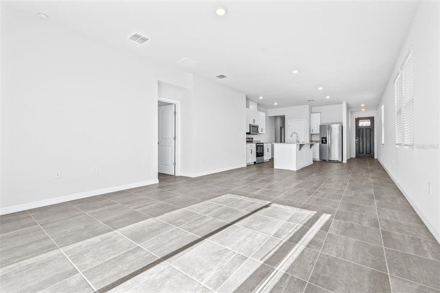 Spacious, unfurnished interior of a new home in The Grove at Stuart Crossing - Premier Series, Bartow (Image 18).