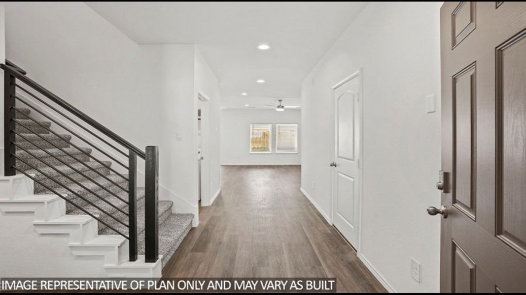 Representative unfurnished interior of a home built from the Midland by D.R. Horton in Sunterra, Katy (Image 13).