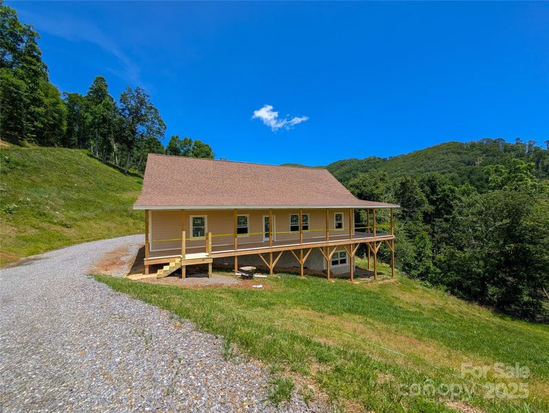 Front exterior of a new home in , Burnsville, NC, highlighting curb appeal (Image 10). Front exterior of a new home in , Burnsville, NC, highlighting curb appeal (Image 10).