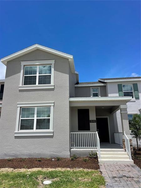 Front exterior of a new home in , Kissimmee, FL, highlighting curb appeal (Image 2). Front exterior of a new home in , Kissimmee, FL, highlighting curb appeal (Image 2).