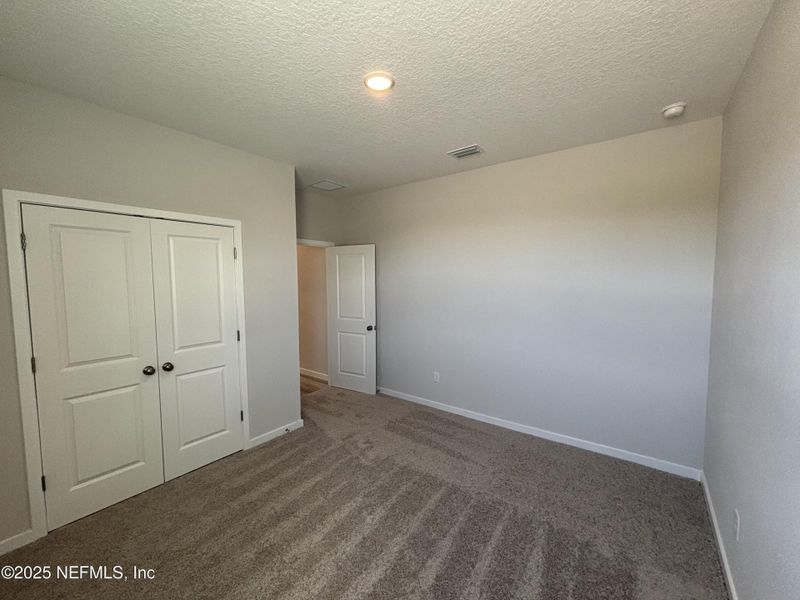 Spacious, unfurnished interior of a new home in The Magnolia Series at Reserve East, Flagler Beach (Image 11).