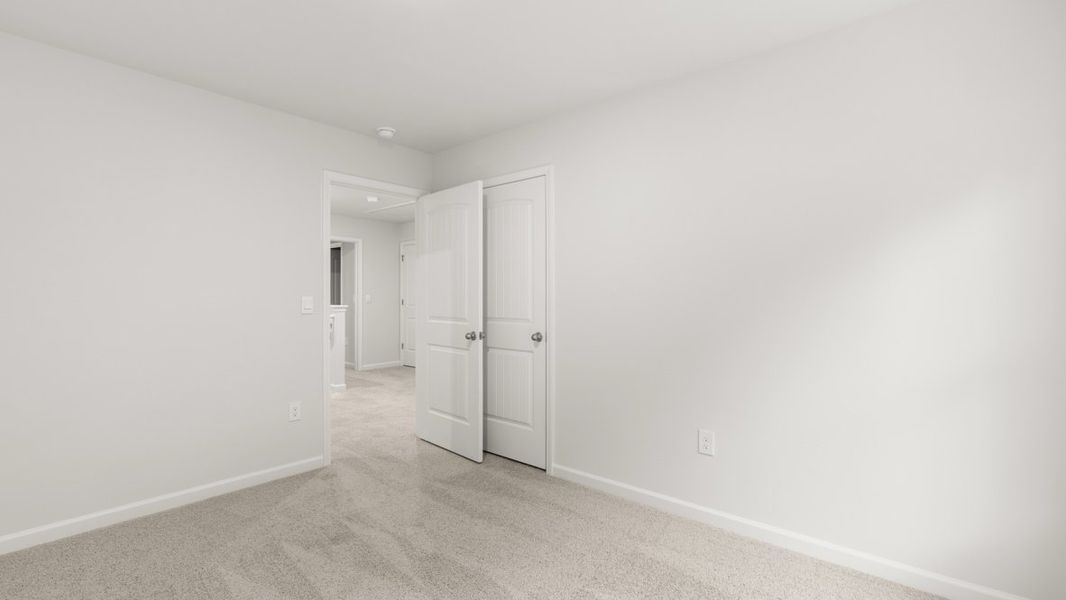 Representative unfurnished interior of a home built from the Salisbury by D.R. Horton in Waypoint, Flowery Branch (Image 27).