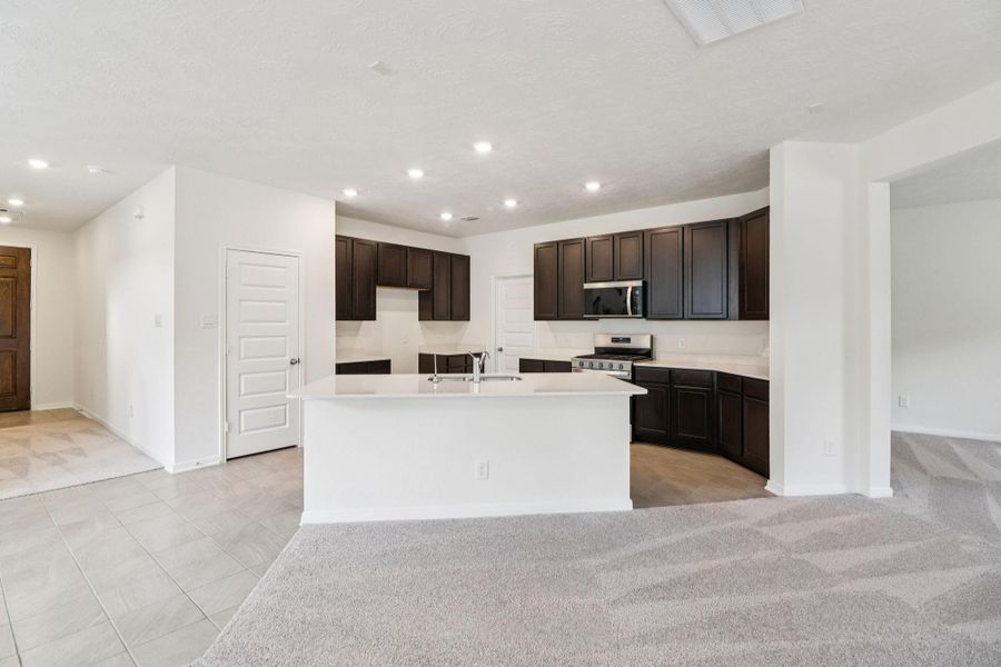 As the true heart of the home, this kitchen serves as a warm and inviting centerpiece for both daily living and effortless entertaining.