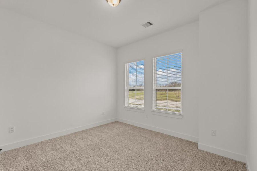 Representative unfurnished interior of a home built from the Sorenstam by Chesmar Homes in Riceland Alley Loads, Mont Belvieu (Image 67).