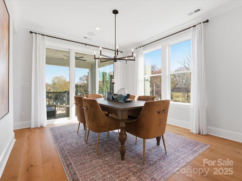 Dining Space Conveniently Off Kitchen Surrounded by Light. *Model Photos | Actual Finishes, Structural Selections, and Orientation May Vary. Dining Space Conveniently Off Kitchen Surrounded by Light. *Model Photos | Actual Finishes, Structural Selections, and Orientation May Vary.