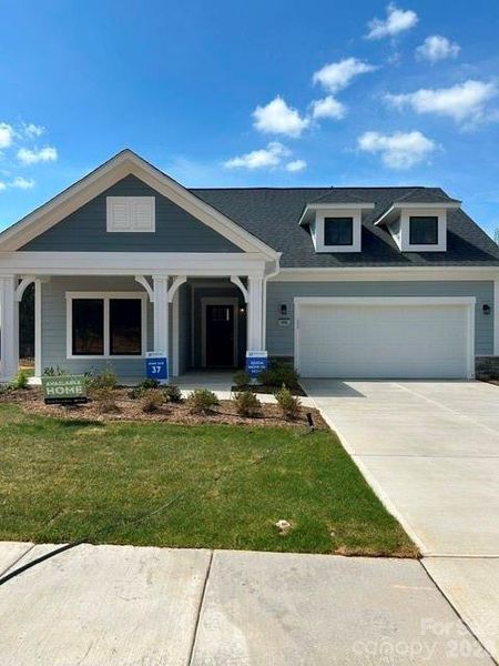Front exterior of a new home in The Courtyards at Hodges Farm, Charlotte, NC, highlighting curb appeal (Image 1). Front exterior of a new home in The Courtyards at Hodges Farm, Charlotte, NC, highlighting curb appeal (Image 1).