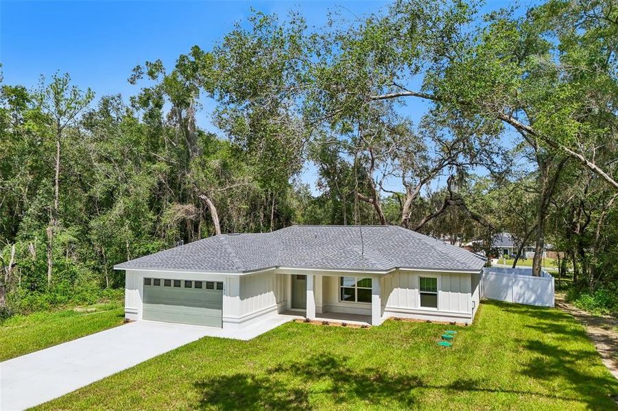 Front exterior of a new home in , Citrus Springs, FL, highlighting curb appeal (Image 24).