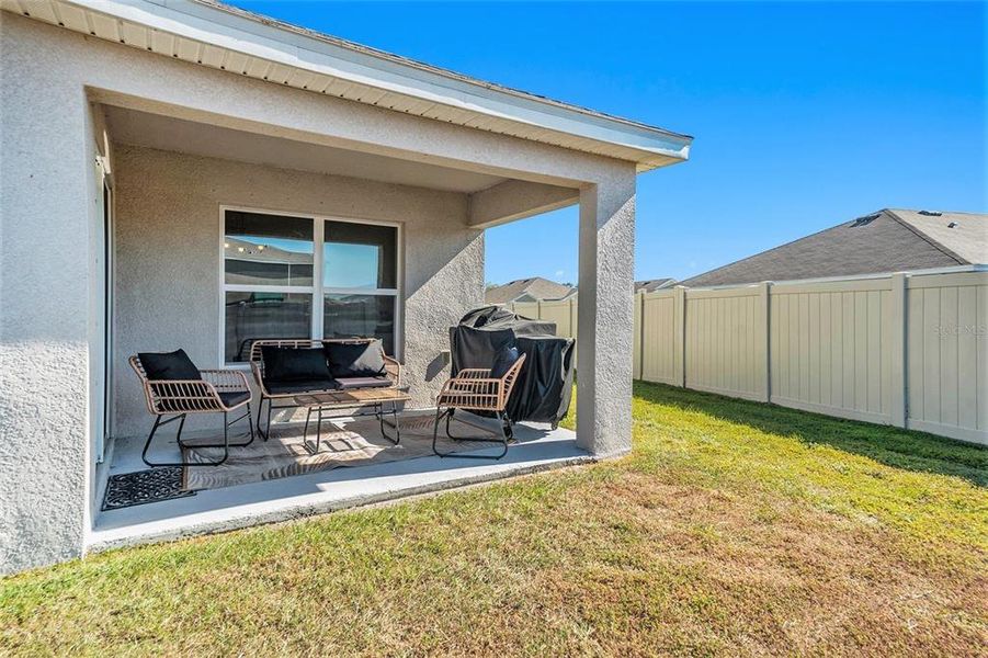 Exterior details and patio area of a home in Bella Lago, Parrish (Image 21).